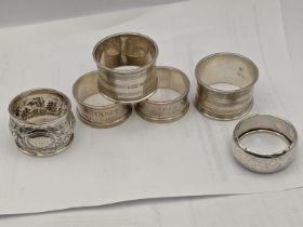 Six silver napkin rings one embossed with fruiting vines, total weight 196.2 Location: