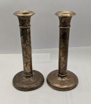 A pair of early 20th century white metal weighted candlestick holders Location: