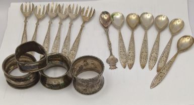 Silver and white metal to include filigree teaspoons stamped 830 with four napkin rings, total