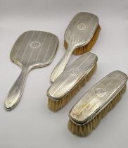 Birmingham 1925 silver dressing table items to include a hand brush and other items having a machine