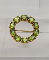 A 9ct gold and peridot bar brooch, total weight 5.1g Location: