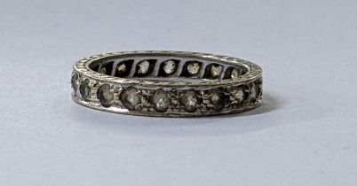 A white metal full eternity band inset with white sapphires, 2.1g Location: