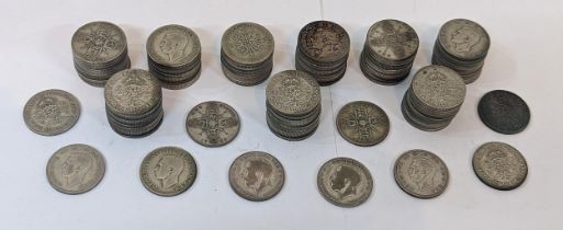 British coins - a quantity of 100 pre-1947 mixed George V and George VI florins/two-shillings,