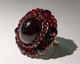 A 19th century garnet set ring converted from a brooch, with a yellow metal shank, 7.3g Location: