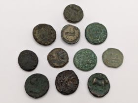 Ancient Greece - A group of eleven mixed coins to include helmeted head of Athena in crested