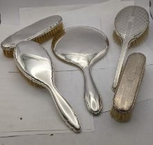Mixed silver dressing table items to include two hand brushes, two dressing table bushes and a