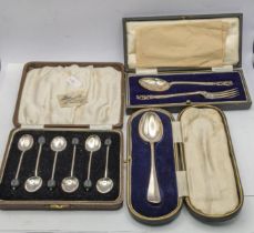 Six silver coffee spoons boxed along with a silver tea spoon boxed and one other total weight 103.3g