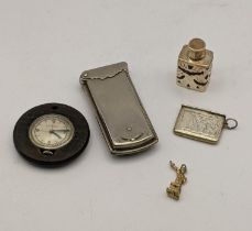 Mixed items to include a silver and glass scent bottle, a sterling silver stamp holder, a needle