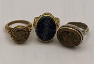 Three Islamic rings set with carved stone seals Location: