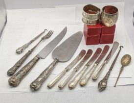 Three silver napkin rings 55g silver handled knives, bread knife, button hook and cake knife