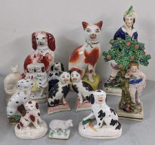 A selection of Staffordshire and Staffordshire style ornaments to include an early 19th century