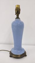 An early 20th century blue mottled glazed table lamp mounted on a metal base Location: