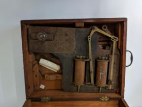 An unusual scientific instrument of purpose in an oak carrying case Location: