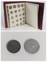 An album of mixed World coins to include 1907 Brazil 2000 Reis, 1922 Albert I Belgian Congo 1 Franc,