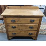 A late Victorian pine chest of three drawers having a raised back and on bracket shaped feet, 89cm h