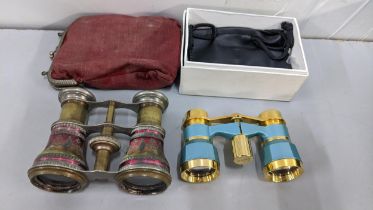 Two pairs of late 19th/early 20th century opera glasses to include a pair of enamelled glasses by