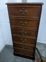 A reproduction mahogany six drawer filing cabinet with insert gilt tooled green leather top, on