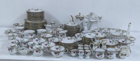 A part dinner/tea service having a floral design on a white background and gilt edges Location: