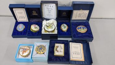 A collection of seven boxed Halcyon Days enamel trinket boxes and a Royal collection box Location: