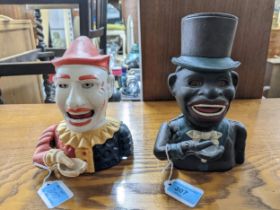 Two painted reproduction cast iron money boxes to include one depicting a clown Location: These