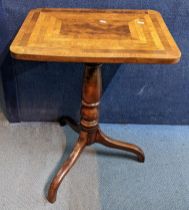 A 19th century tilt top table having a mixed veneer top and on three splayed legs, 71cm h x 55cm w