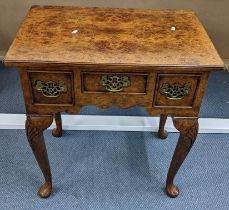 A Georgian inspired burr yew quarter cut veneered low boy having three drawer on pad feet 72.5hx68.