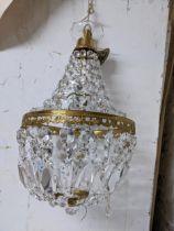 A gilt metal ceiling bag light with faceted glass drops Location: