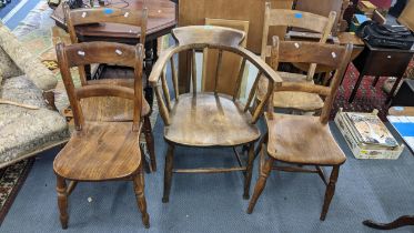 A late 19th/early 20th century Captains chair together with a set of four bar back chairs Location: