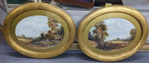 A pair of early 20th century oval gilt framed oil paintings depicting country scenes 40cm x 29.5cm