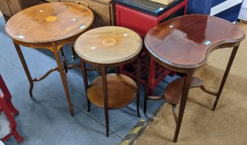 An Edwardian mahogany kidney shaped table, together with two circular topped occasional tables