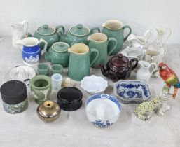 A mixed lot to include Denby teapots, jugs and others, a Capodimonte parrot, Wedgwood jasperware