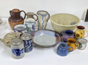 A collection of art pottery to include a 19th century Stiff & Sons jug, two German tankards and