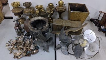 A mixed lot of metalware to include oil lamps, cutlery, retro limit fan, jug pans and other items