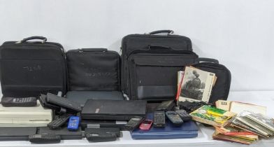 A mixed lot of vintage electrical items to include various laptops and mobile phones and mixed