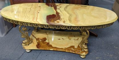 A vintage only two tier coffee table having gilt metal dolphins shaped supports 46hx117w Location: