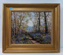 Deborah Poynton oil on canvas, depicting a footpath through a woodland with bluebells, bears a