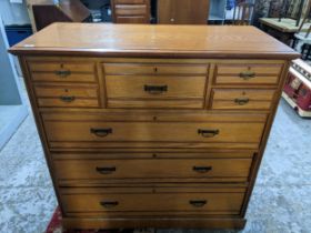 A Victorian Maple & co. chest of drawers, central hot drawer flanked by two short drawers to each