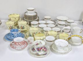 A mixed lot of cups and saucers to include a Royal Albert flowers of the month series October