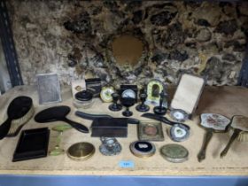 A mixed lot to include two silver strict photograph frames and one other dressing table brush