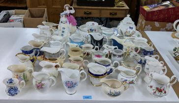 A collection of approx. fifty milk and cream jugs to include Aynsley, Royal Albert and Aynsley