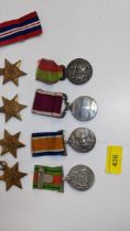 Medals to include four WWII Stars of Defence, a long service and Good Conduct awarded to 3003 OM SJT