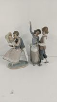 A Lladro group folk dancing, together with Lladro porcelain figurine 'Precious Love' Location: