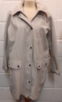 Barbour- A ladies Mist Undertow waterproof hooded raincoat, never worn, having a pale blue tartan