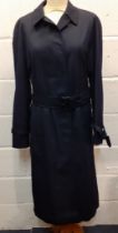 Aquascutum-A ladies navy rain mac with belt having black leather detail to belt buckle and cuff