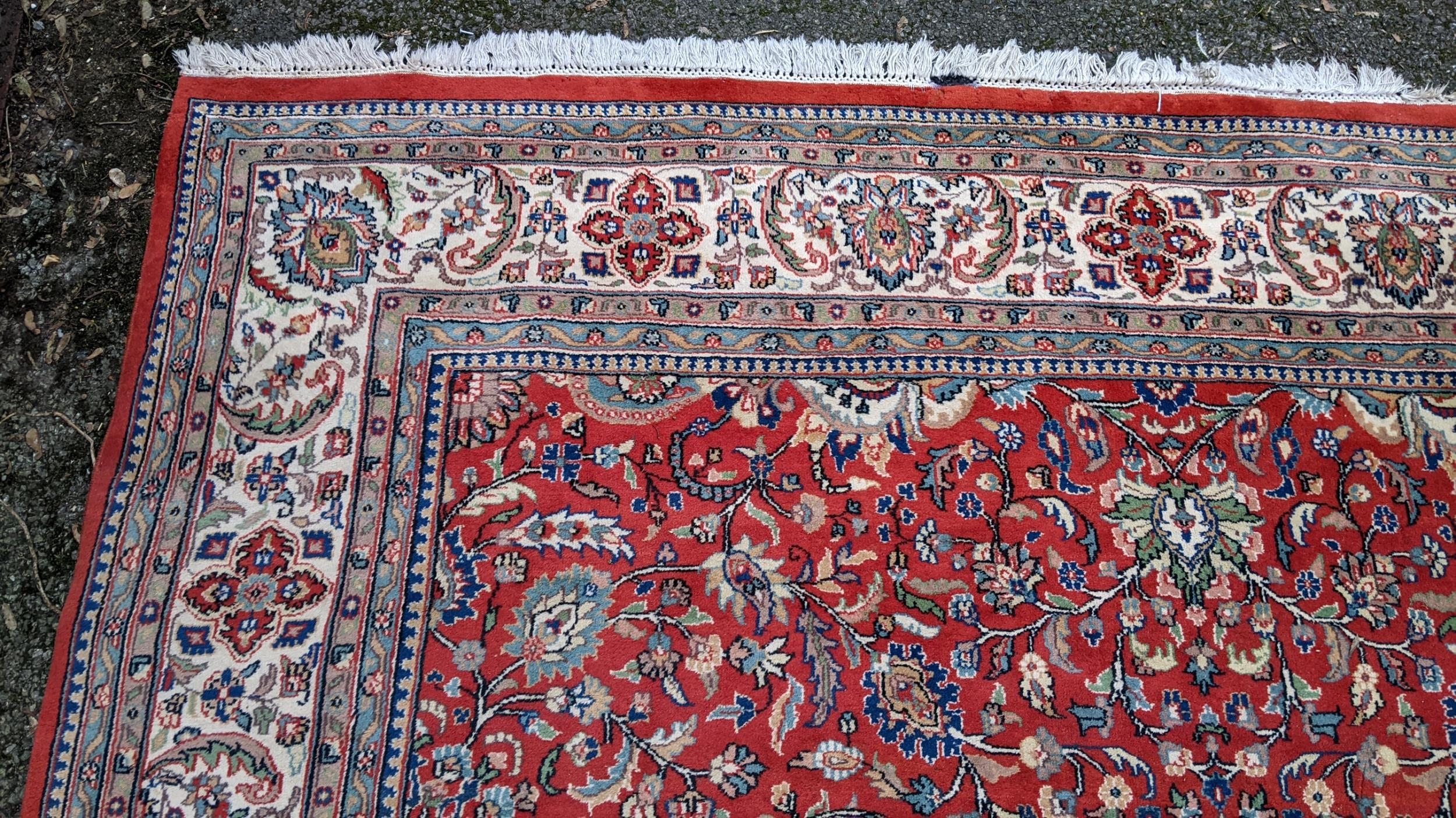 Persian hand woven rug having a red ground with a floral design multiguard borders and tasselled - Image 7 of 8
