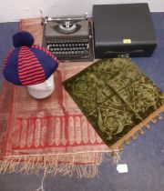 A 1970's bobble hat, an Imperial typewriter, an Indian wrap and a Victorian Diamond Jubilee panel.