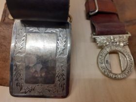 Two vintage leather belts comprising a London Scottish Volunteers brown belt and a Scottish black