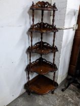 A reproduction mahogany corner whatnot, five shaped graduated shelves supported on turned columns