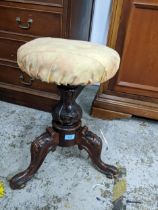 Victorian mahogany swivel top music stool circular upholstered seat carved stone support on three