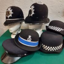 A quantity of British Constabulary police officer hats to include 2 Warwickshire Police hats, a